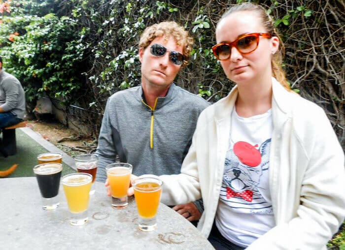 A couple gets ready to sip on tasters at Green Flash Brewing in San Diego.