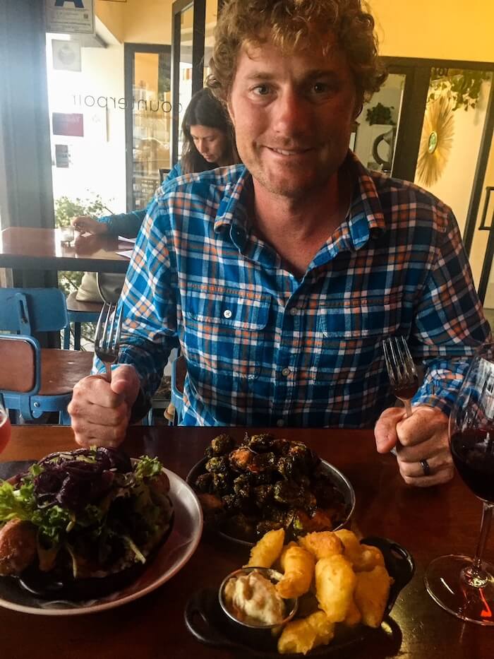 A man sits down for a meal in Golden Hill, San Diego.