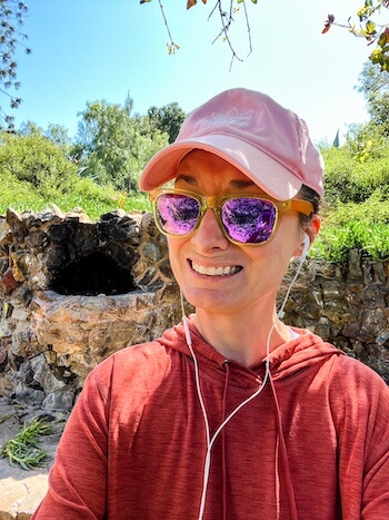 A woman smiles with some hesitation at a park in Golden Hill, San Diego.