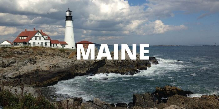 A lighthouse in the distance and MAINE in bold font