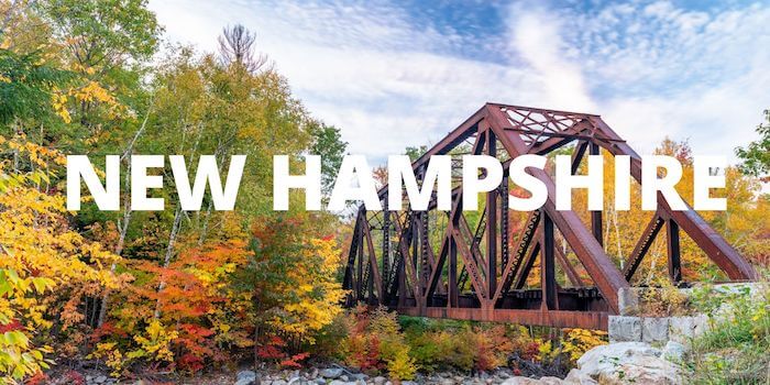 A scenic bridge and NEW HAMPSHIRE in bold font