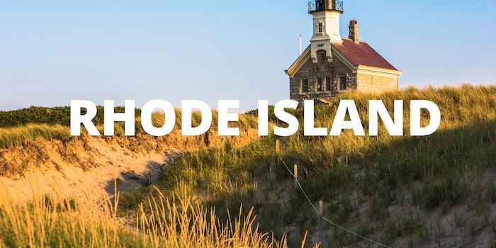 A lighthouse in the background and RHODE ISLAND in large font down the middle