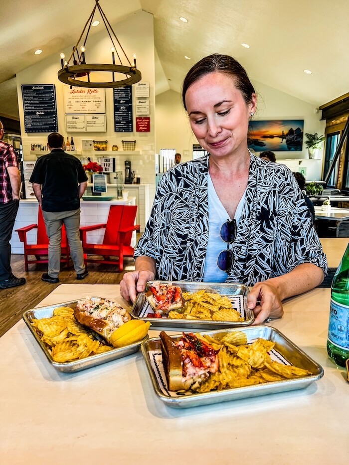 A woman gets ready to eat a lobster roll in Salt Lake City.