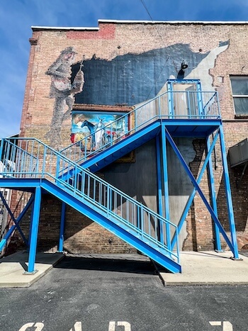 A colorful mural up a staircase in Salt Lake City