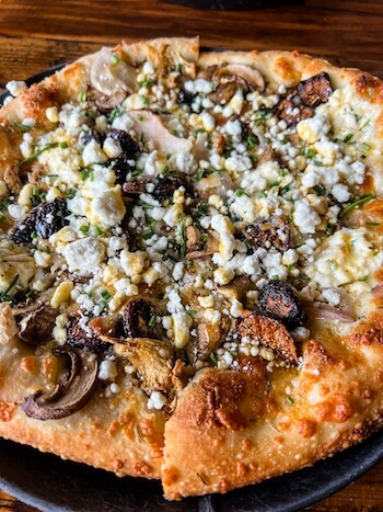 A decadent pizza at Slackwater in Salt Lake City