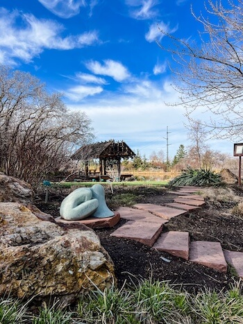 A sculpture up against a pond at the Red Butte Garden in Salt Lake City