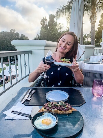 A woman prepares to eat a delicious meal.