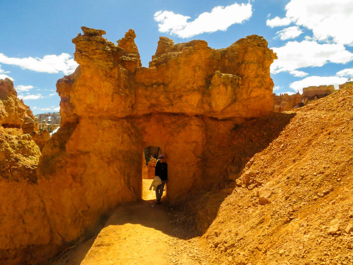 A woman under an archway in Bryce Canyon National Park