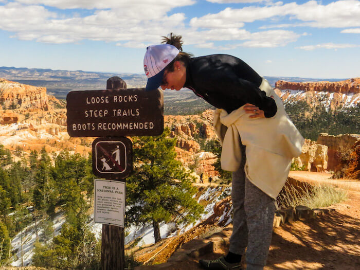 A woman rests on a hike at Bryce Canyon National Park.
