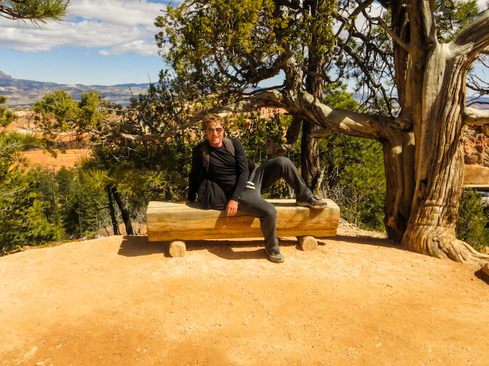 A man relaxes on a bench at Bryce Canyon National Park.
