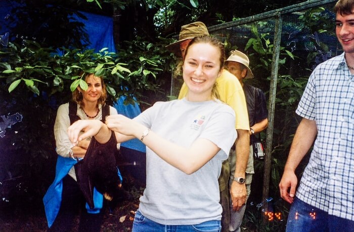 A woman holds a bat.