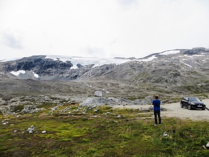 A man looks at a glacier in Norway.