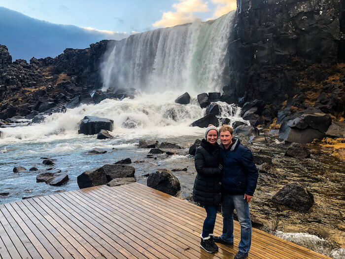 A couple poses at Thingvellir National Park in Iceland.