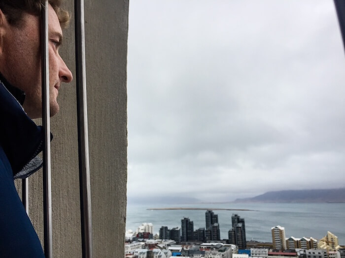 A man looks out on scenic Iceland in Reykjavik.