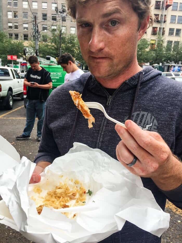 A man eats a quick lunch at a food truck in Portland.