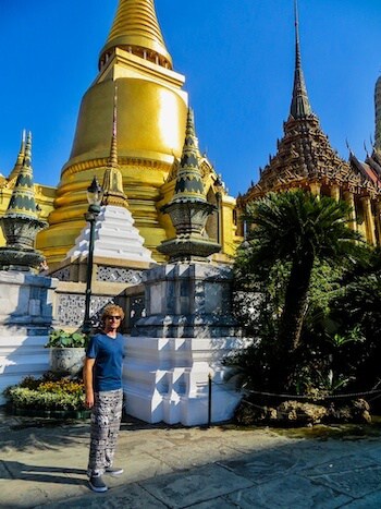 A man poses at Wat Phra Kaew in Thailand.