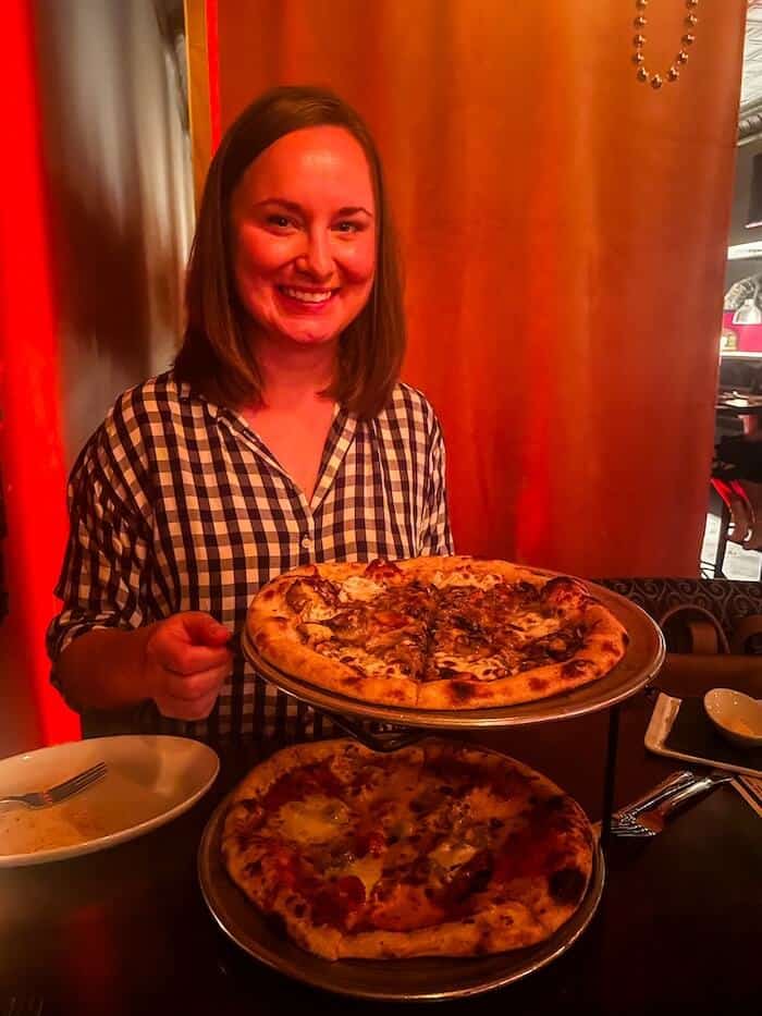 A woman poses with her pizza in Augusta.