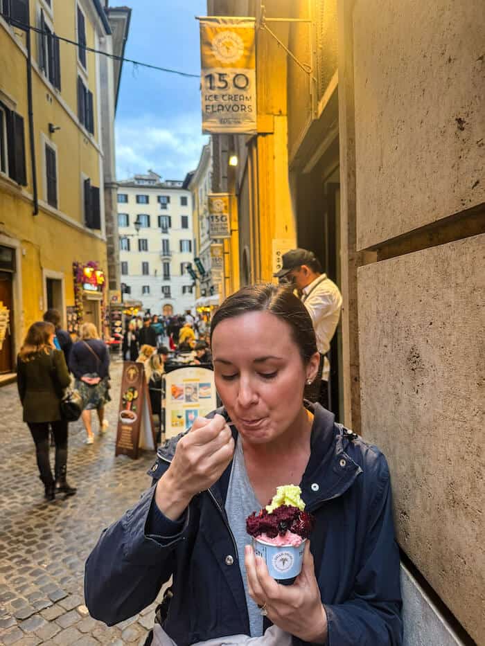 A woman eats gelato in Rome.
