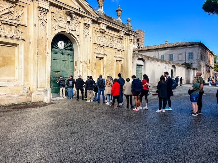 People wait in line at the Knights of Malta Keyhole in Rome.