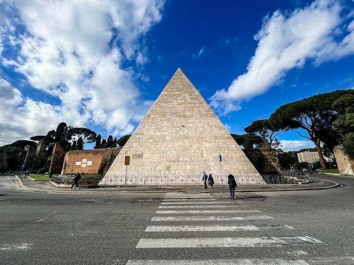 The Pyramid of Caius Cestius against a blue sky in Rome