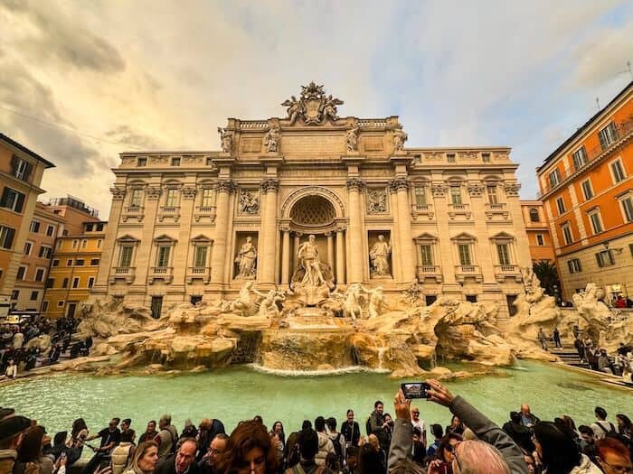 Crowds pack the Trevi Fountain in Rome.