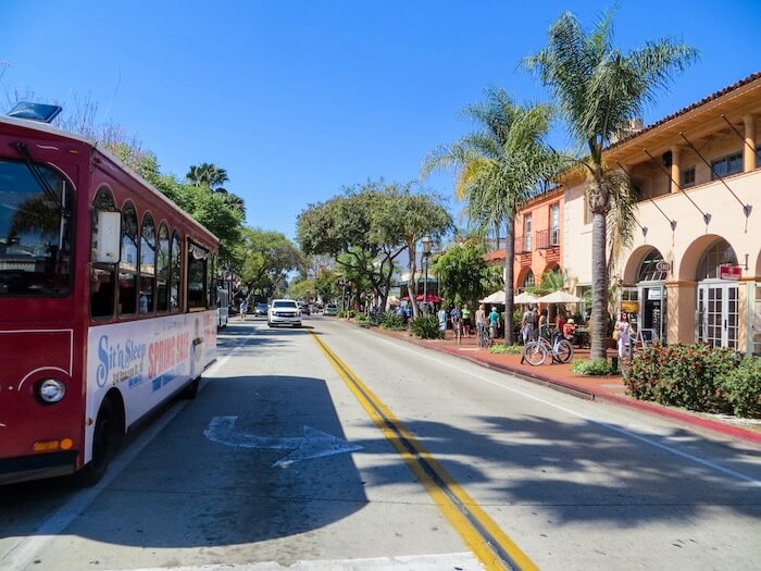 A trolley rides down State Street in Santa Barbara.