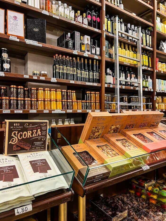 A shop with bottles of balsamic vinegar as a response to, "Is Bologna worth visiting?"
