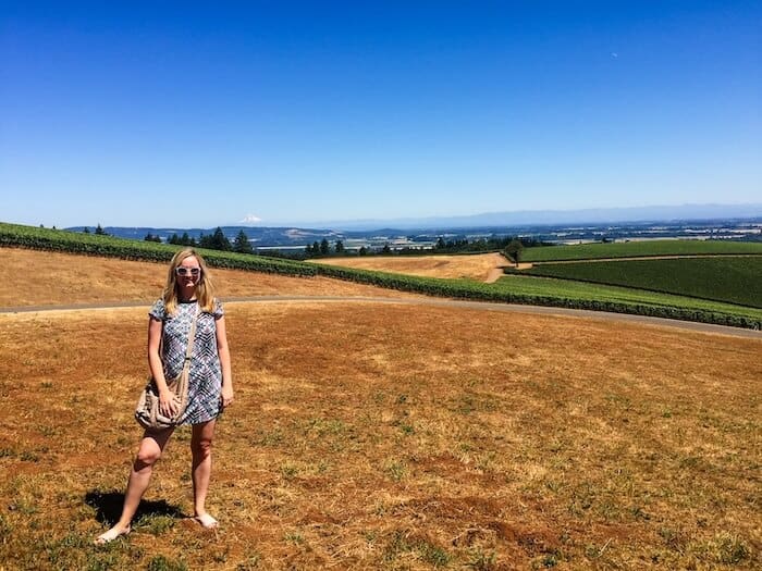 A woman poses at a winery in Oregon.