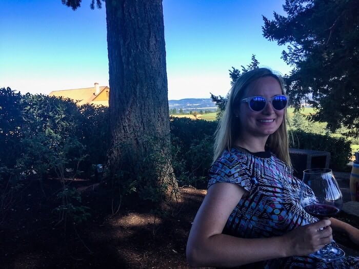 A woman poses at a winery in Oregon.