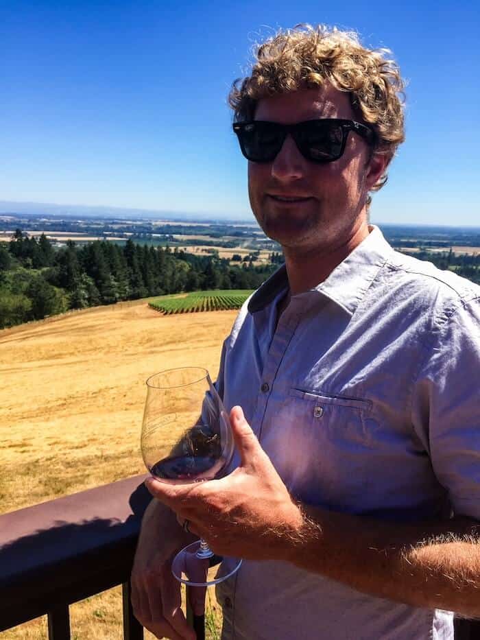 A man poses at a winery in Oregon.
