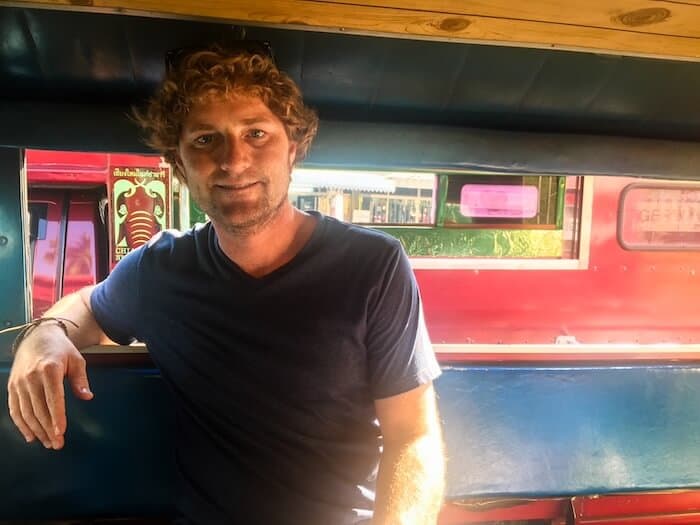 A man sits on a bus in Chiang Mai.