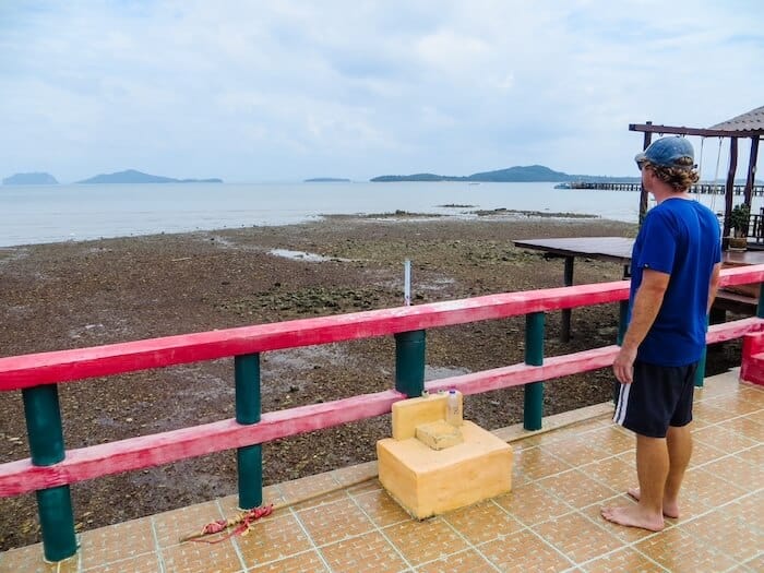 A man looks out onto Old Town in Koh Lanta.