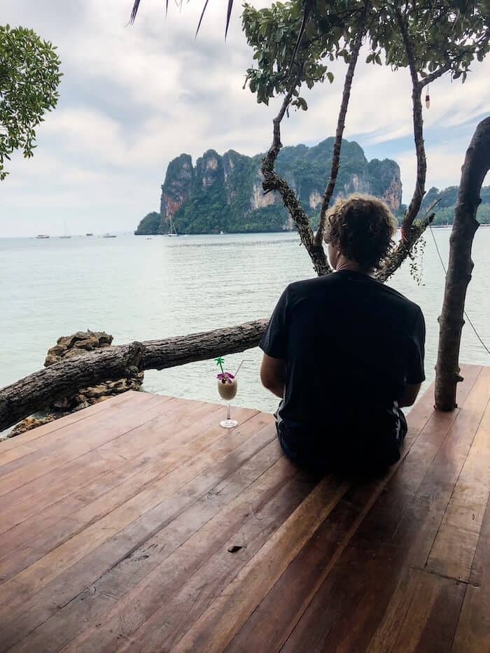A man looks out at the view on a Thai island.