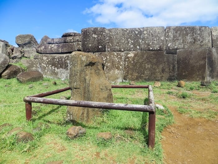 A moai surrounded by a fence on Easter Island