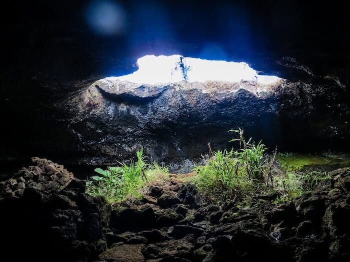 Light floods from an opening of Ana Te Pahu Cave on Easter Island.