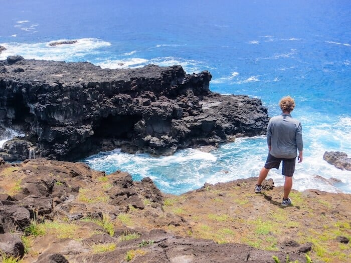 A man takes in the Easter Island scenery from a viewpoint.
