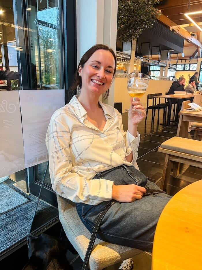 A woman enjoys a Westvleteren beer.