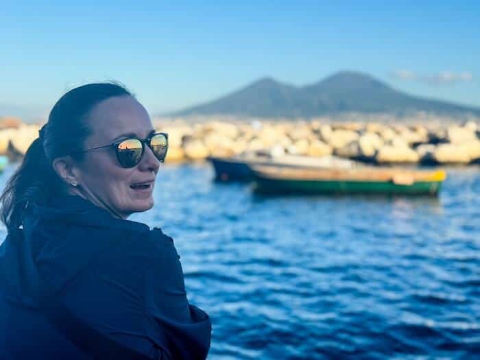 A woman poses at the waterfront in Croatia.