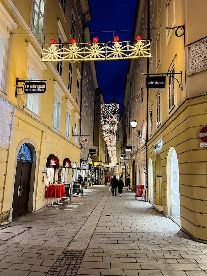Twinkling holiday lights along Getreidegasse in Salzburg