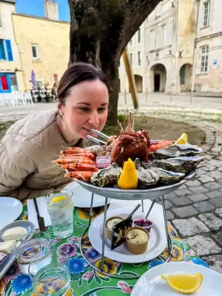 A woman gets ready to eat some seafood at Le Panier de Crabes in La Rochelle.