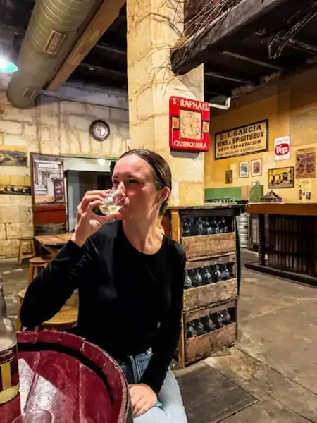 A woman sips on wine soda at La Guignette in La Rochelle.