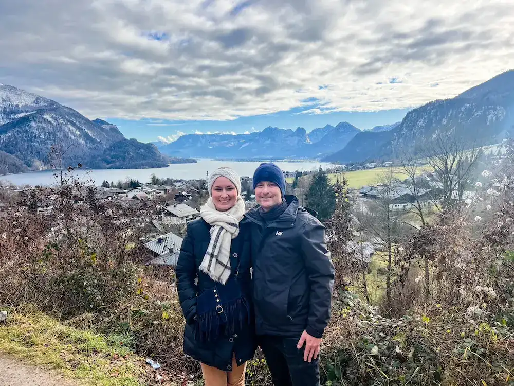A couple poses at a viewpoint on a Sound of Music tour near Salzburg.