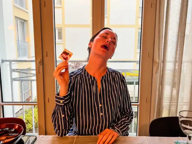 A woman loses a card game in France.