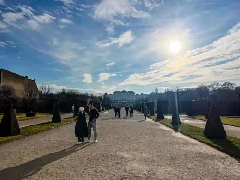 A sun shines on the Belvedere Palace in Vienna, Austria.