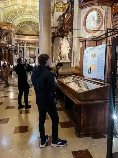 A man looks at an exhibit at the Austrian National Library in Vienna.
