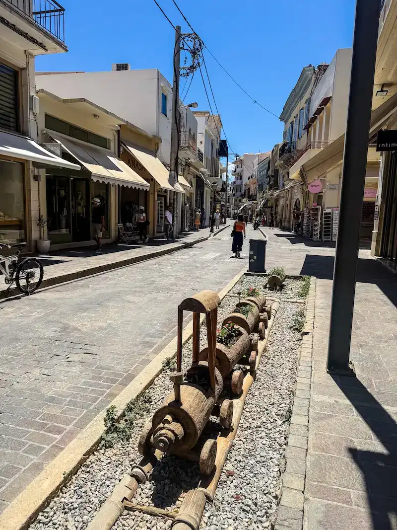 A person walks through a town in Crete.