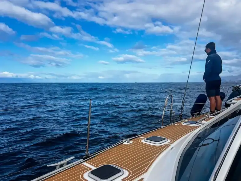 A man looks for wildlife on a whale watching tour in Tenerife.