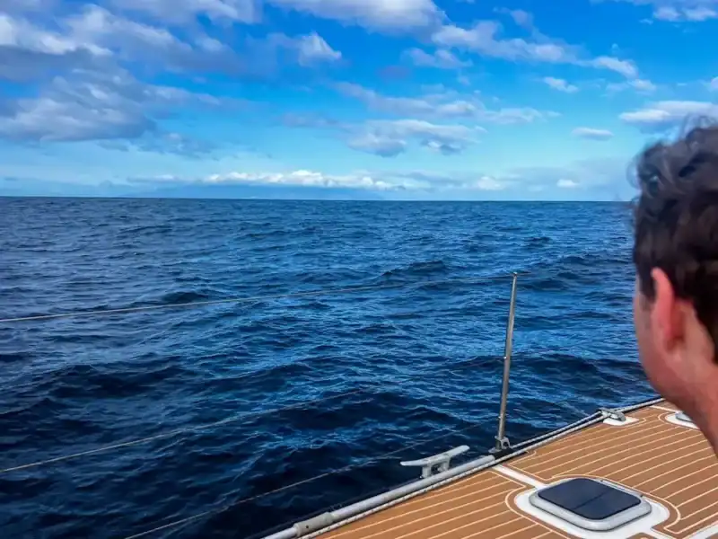A man looks out at the sea on a whale watching trip in Tenerife.