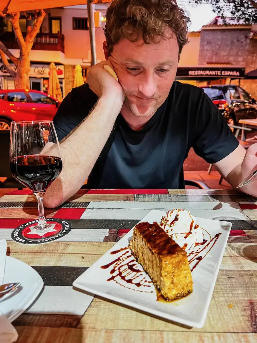 A man gets ready to eat dessert in Tenerife.