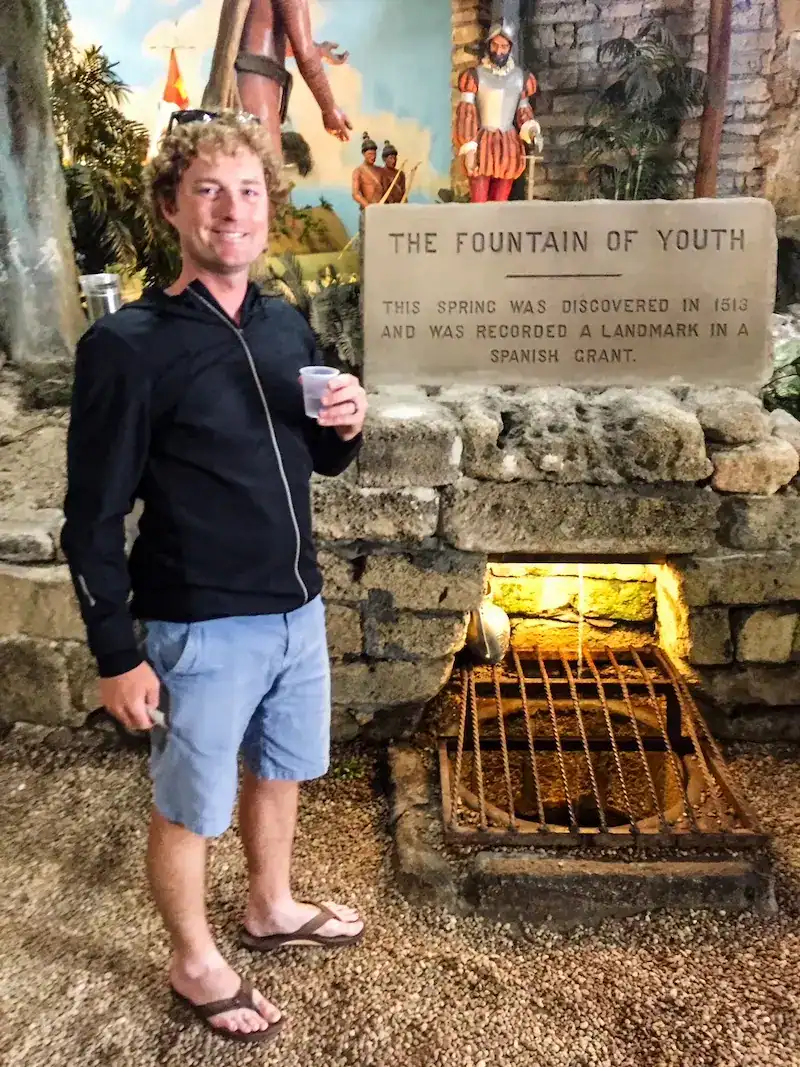 A man poses at the Fountain of Youth in Florida.